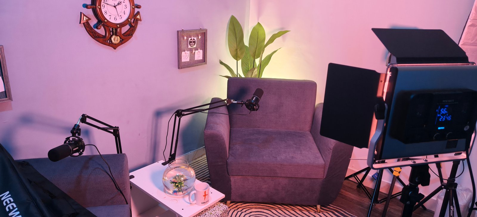 Inside the HalfWall live room — warm brick, microphones, a session in progress
